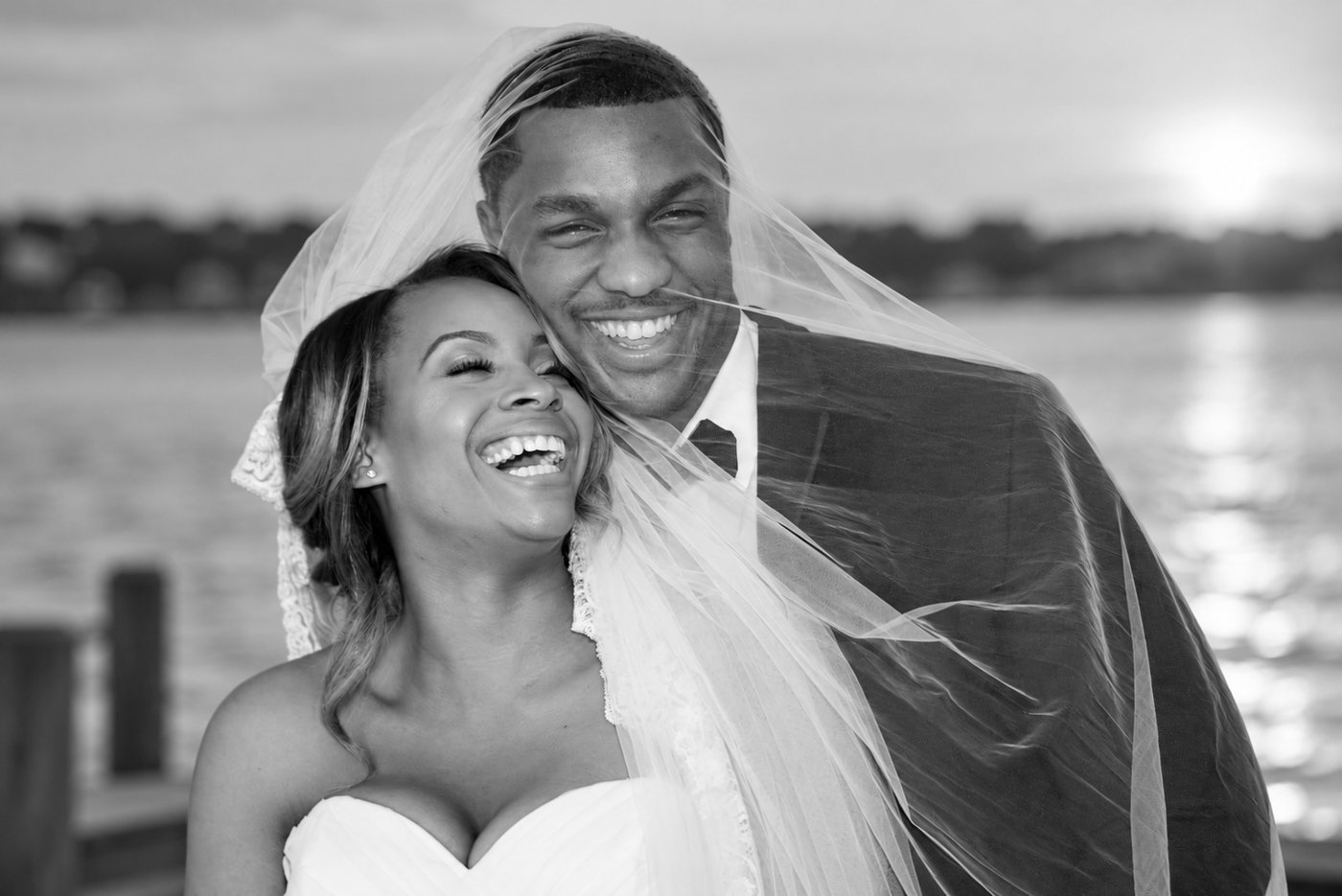 Que and Liz Coples laughing together on their wedding day